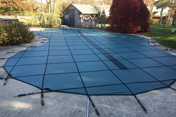 A Garrett pool safety cover over an inground pool - Island Pools MA Gaber Green UltraSolid