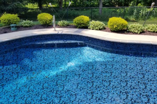 a recently installed in ground pool vinyl liner with stairs - Lal Anurag