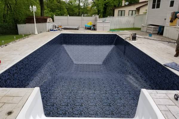 a newly installed perfect fit Garrett vinyl pool liner - MP Nightlife