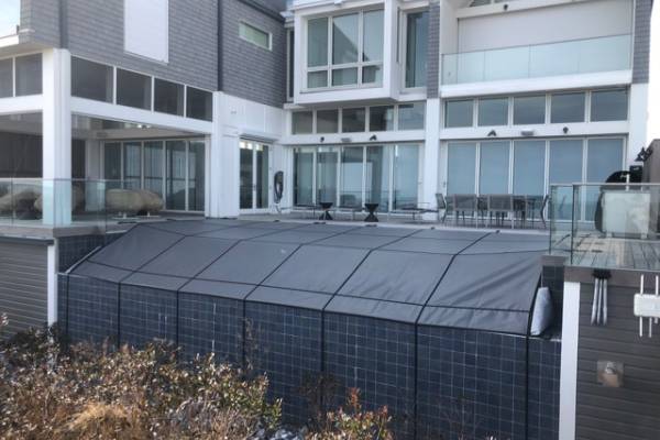 A Garrett pool safety cover over an inground pool - Melchiorre