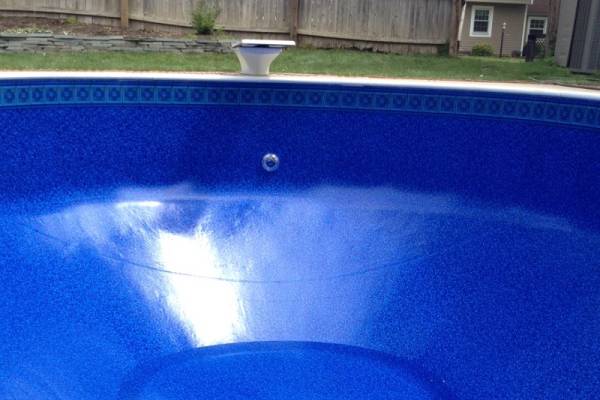a newly installed perfect fit Garrett vinyl pool liner - Rosetta Tile Ripple Oval