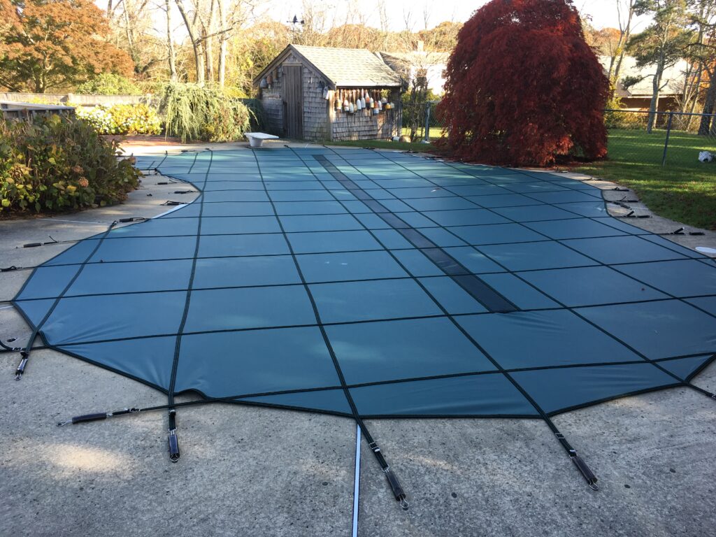 an inground pool with a Garrett pool safety cover