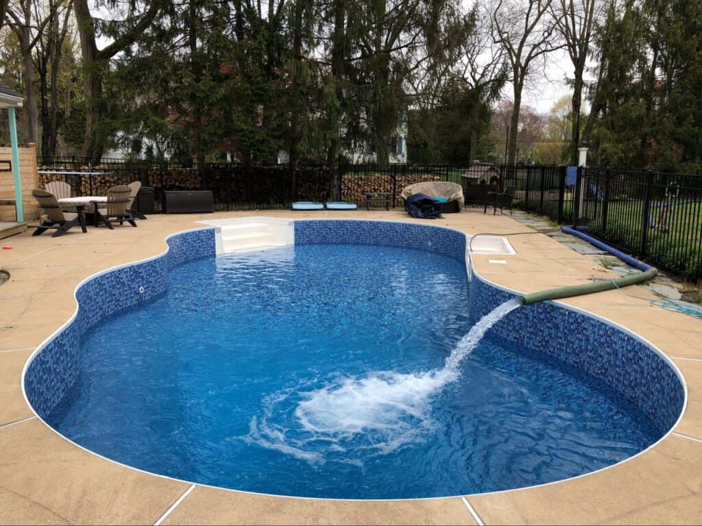an inground pool featuring a vinyl pool liner with all over liner prints by Garrett